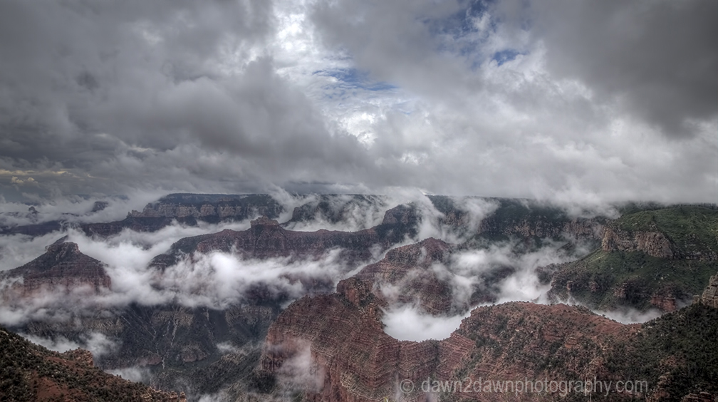 Fog lifts from the Bottom of The Grand Canyon from Point Imperial at Grand Canyon National Park, Arizona