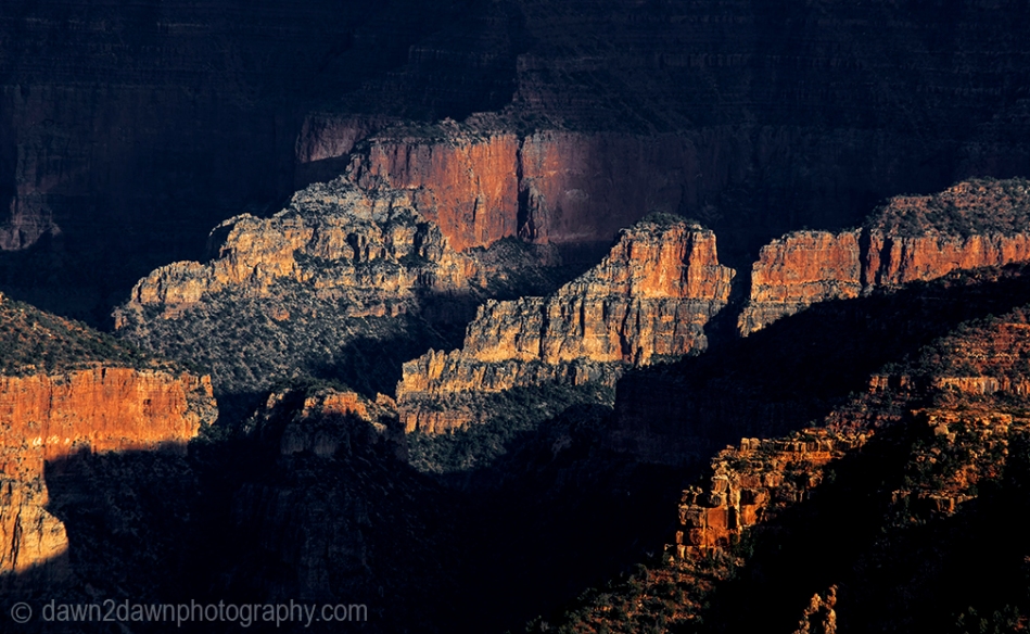 The settting sun forms shadows on the Grand Canyon at Point Imperial