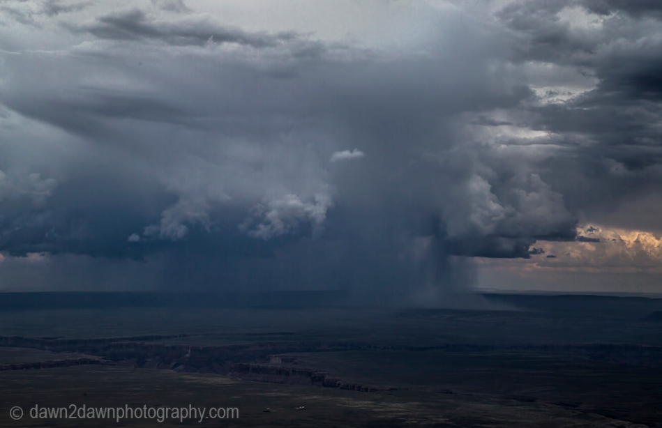 A monsoonal storm cell passes through the Northern Arizona landscape near The Grand Canyon.