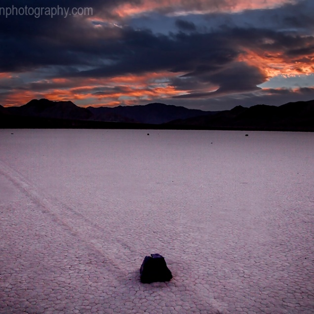 The sun sets on the moving rocks at Racetrack Playa at Death Valley National Park