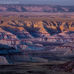 The sun sets on the badlands of Ha Ho No Geh Canyon on the Hopi Indian Reservation, Arizona