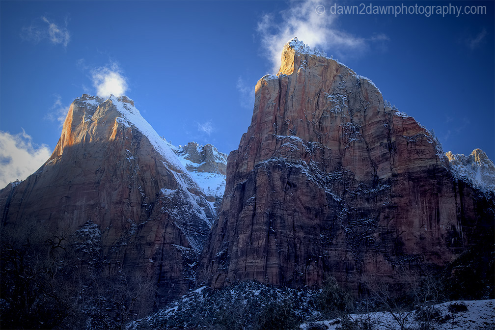 Fresh snow has fallen during winter at The Court Of The Patriarchs at Zion National Park, Utah