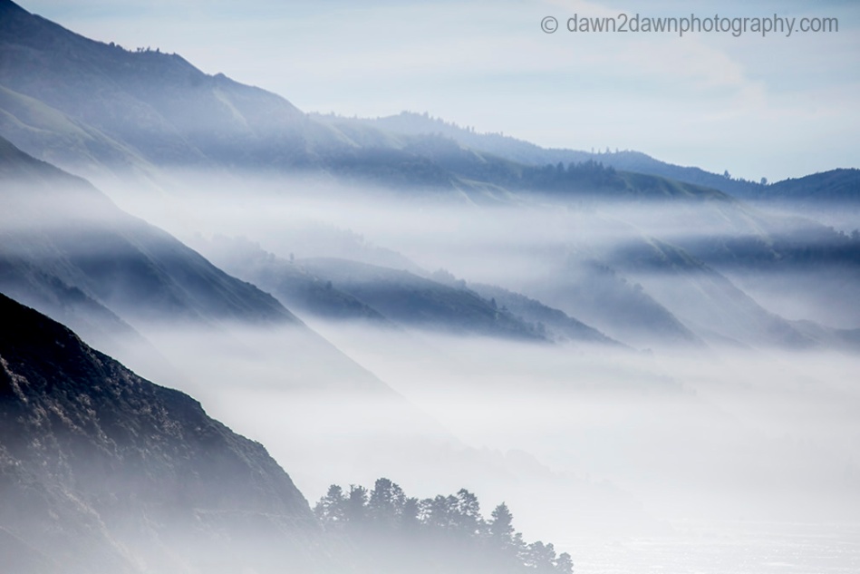 Fog rolls into the highlands along California's Pacific Ocean Coast at Big Sur.