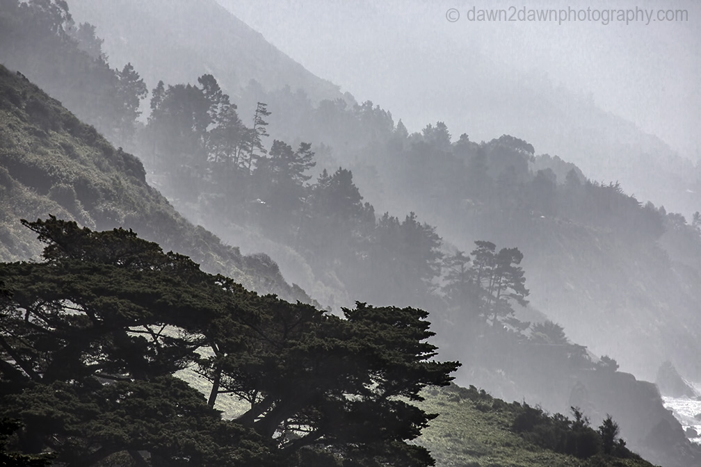 Fog rolls into the highlands along California's Pacific Ocean Coast at Big Sur.