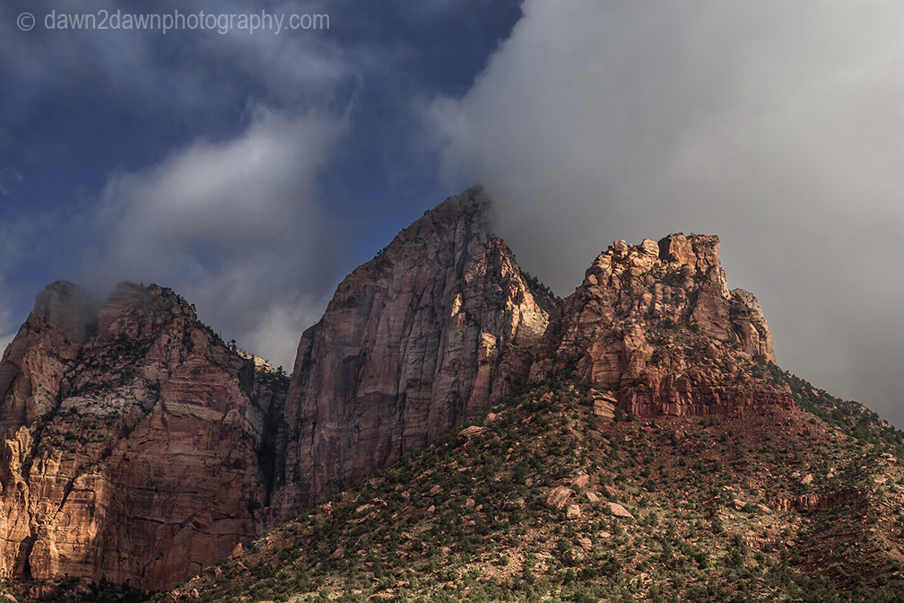 Fog lifts in Zion Canyon after a morning of rain at Zion National Park, Utah.