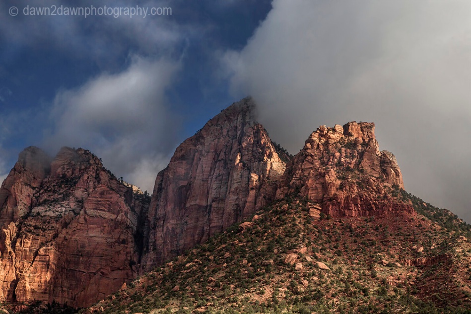 Fog lifts in Zion Canyon after a morning of rain at Zion National Park, Utah.