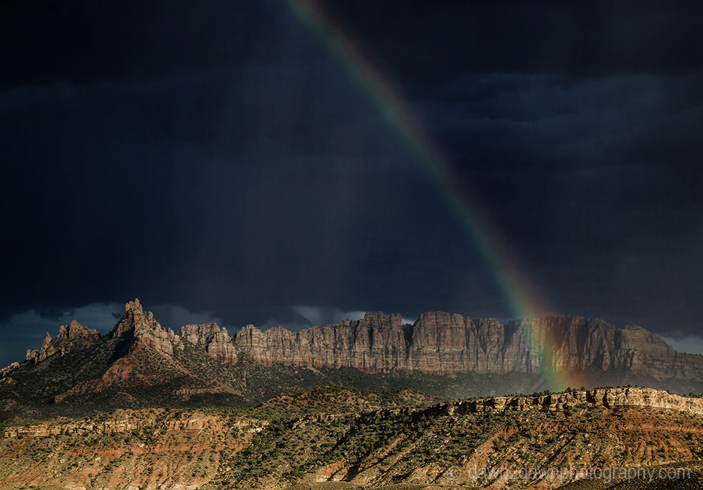 A rainbow appears during a thunderstorm at Eagle Crags near Zion National Park, Utah
