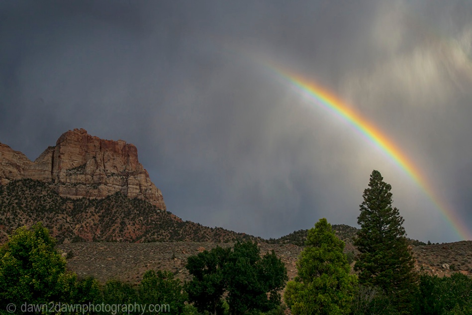 A rainbow appears during a thunderstorm at Zion National Park, Utah