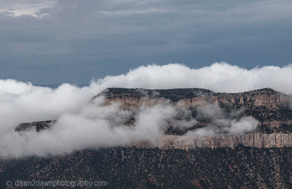 The fog rises from the bottom of the Grand Canyon at Timp Point, Arizona