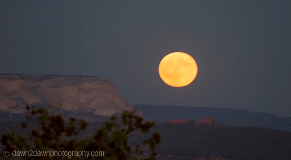 A full moon rises over the outhern Utah landscape near Kanab.