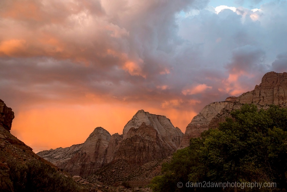 The sun sets on Zion Canyon and some stormy clouds at Zion National Park, Utah