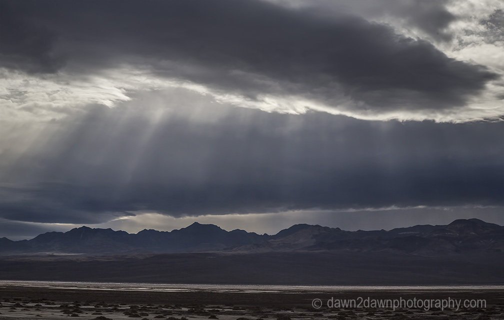 Unusual rainstorms pass through Badwater Basin at Death Valley National Park, California
