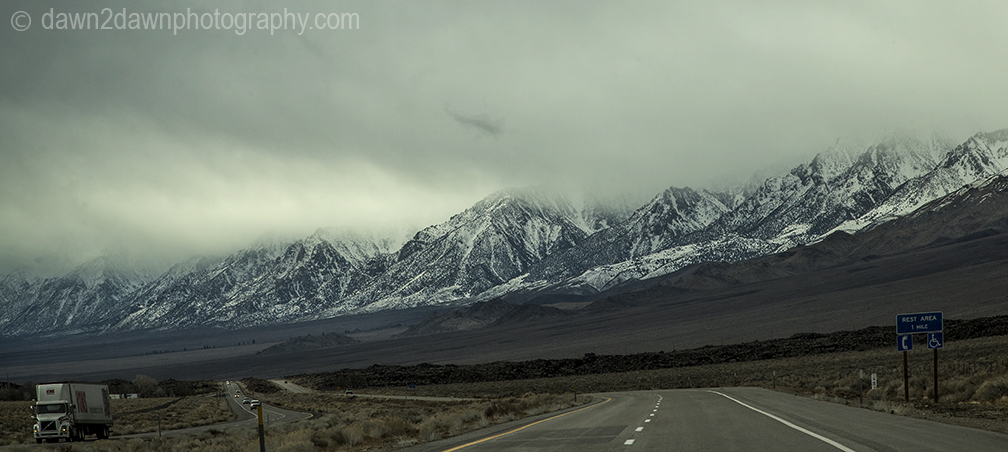 The snow-covered Sierra Nevada Mountains are the predominate feature at Owens Valley, California