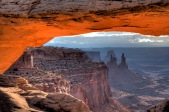 WASHER WOMAN ARCH AND MONSTER TOWER AS SEEN THRU MESA ARCH IN CANYONLANDS NATIONAL PARK, UTAH